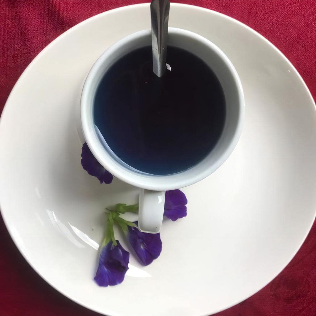 how-to-make-butterfly-pea-flower-tea-with-honey-6-stir-until-dissolved-min how-to-make-butterfly-pea-flower-tea-with-honey-6-stir-until-dissolved-min